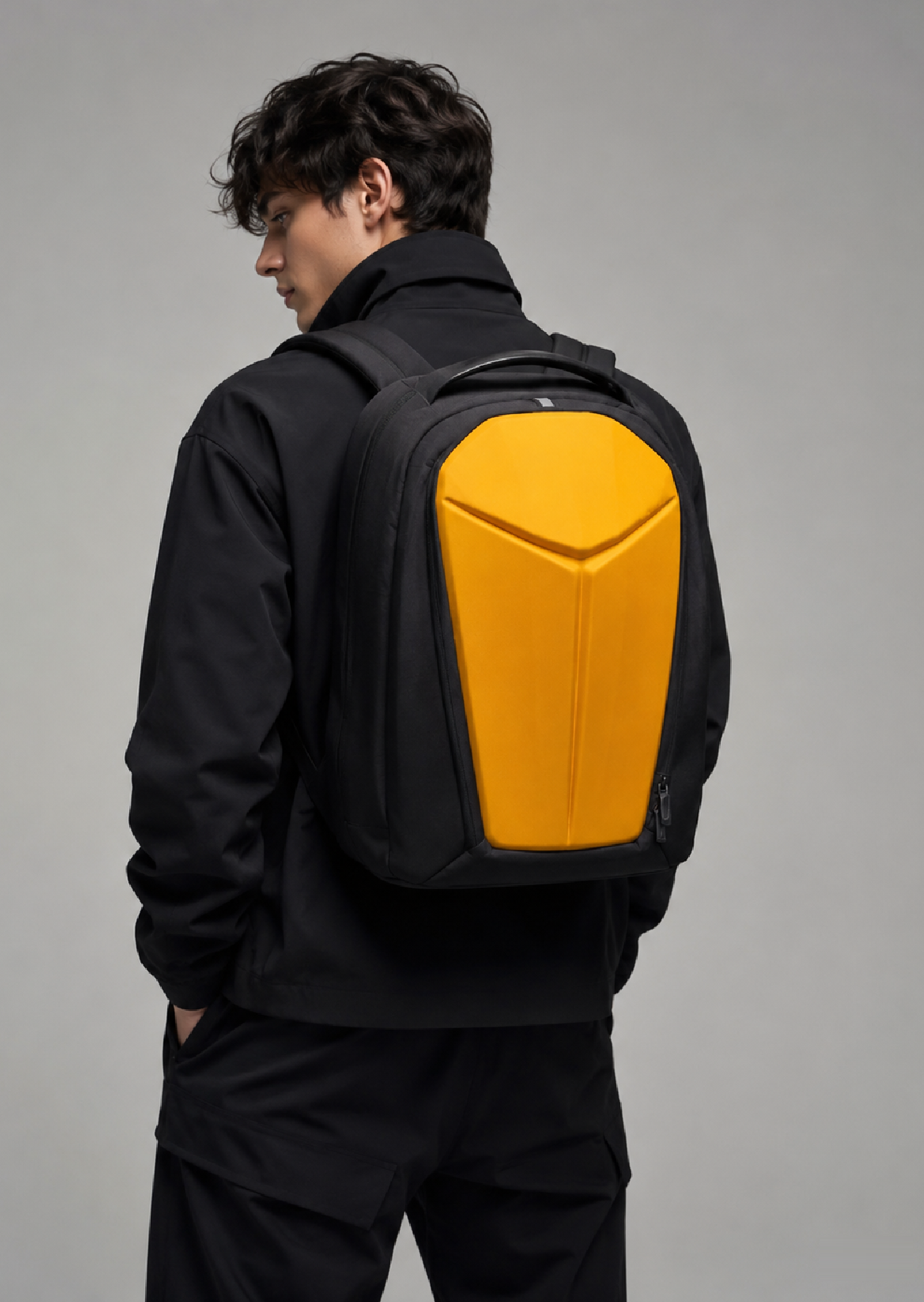 VANDAL Backpack in Black and Yellow, 20L hard-shell commuter backpack, worn on the back