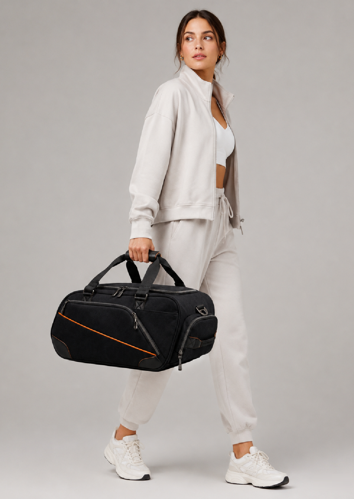 PROTO Duffle Bag in Black with orange trim, 40L gym and weekend duffle carried by the handles